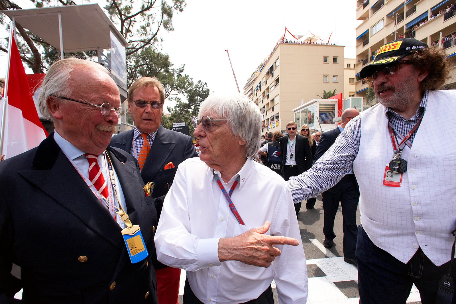 Bernie Ecclestone on the grid with Rudolf Graf von der Schulenburg, acting AvD president, and star photographer Monty Shadow (right hand)