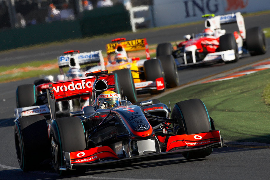 Lewis Hamilton leads the middle field in front of Trulli, Alonso and Glock
