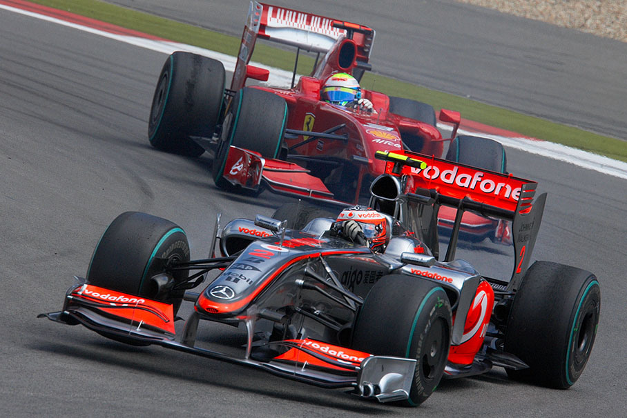 Heikki Kovalainen, McLaren Mercedes, in front of Massa's Ferrari