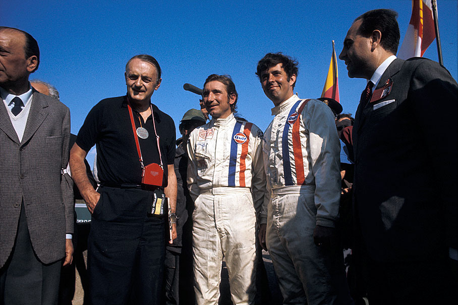 John Wyer with his winning drivers Jo Siffert (CH) and Brian Redman (GB) who shared a Porsche 908/03 #008
