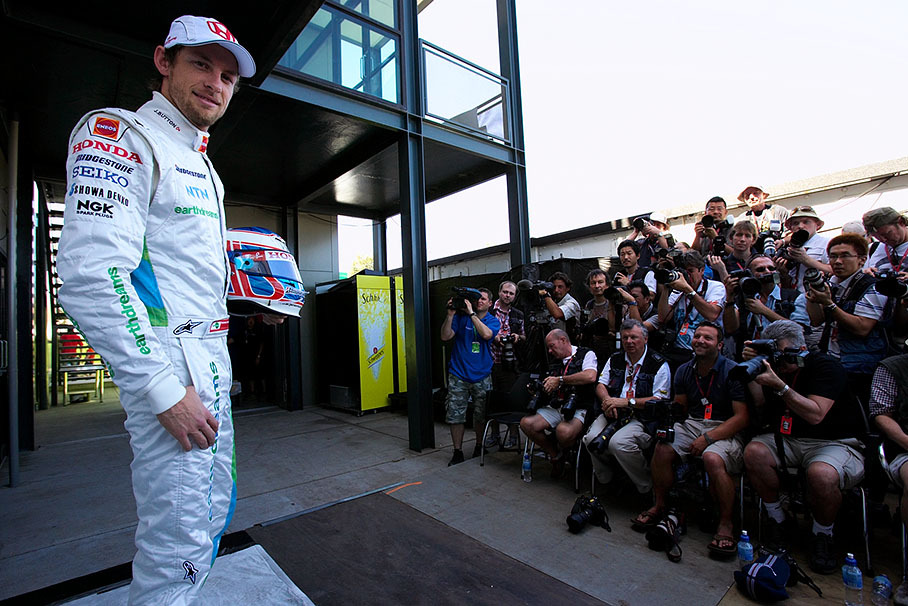 Honda driver Jenson Button poses for the annual season start drivers presentation