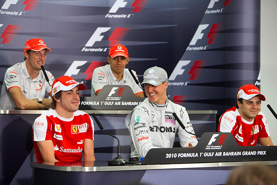 Alonso and Schumacher feel cosy during their first press conference in 2010