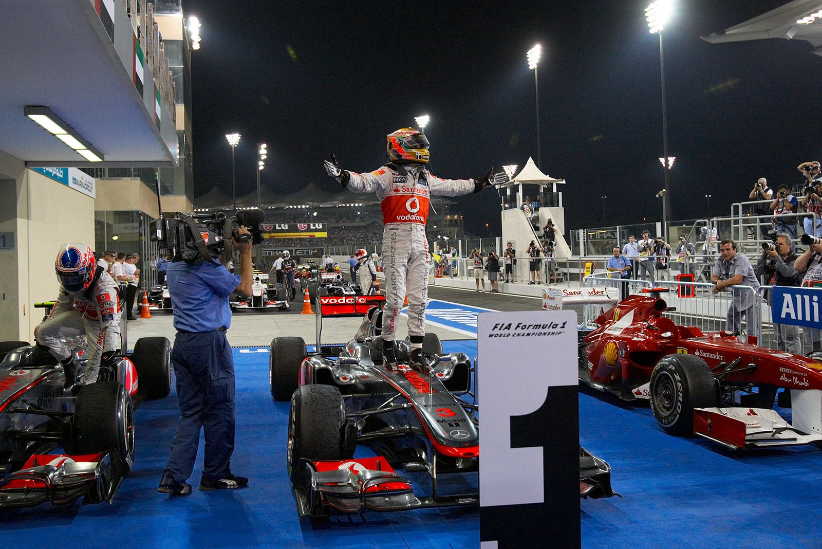 Race winner Lewis Hamilton of McLaren Mercedes celebrates in parc ferme after the Abu Dhabi Grand Prix