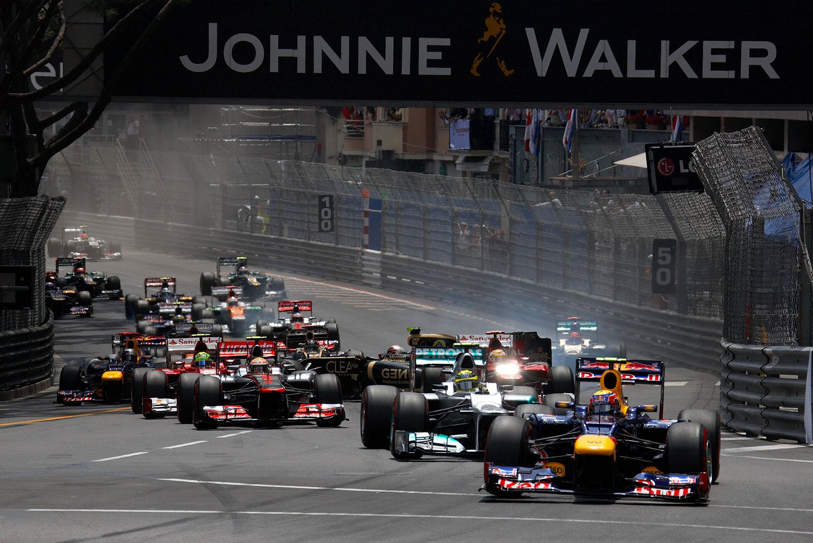 At the start, after a collision with Schumacher, Romain Grosjean's Lotus cannonballs through the field