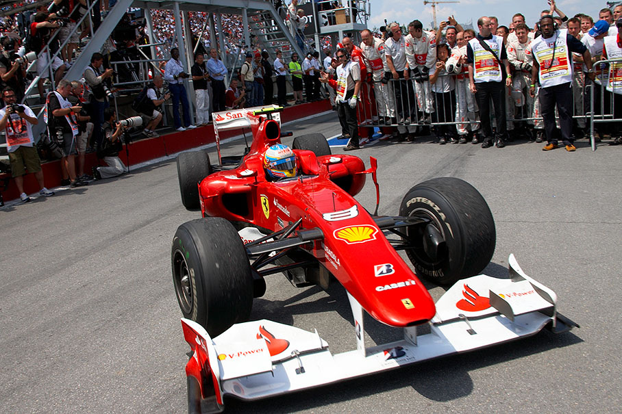 Third placed Fernando Alonso arrives in parc ferme after the race