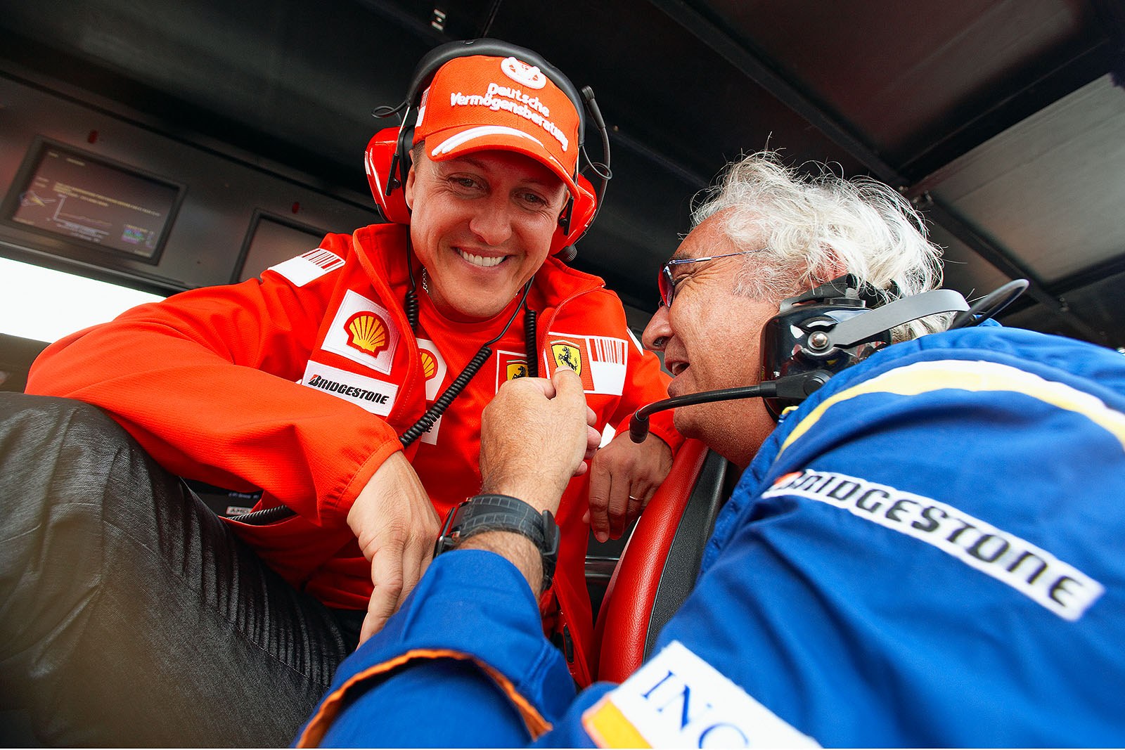 Michael Schumacher jokes around with Flavio Briatore, his team boss in his rookie times