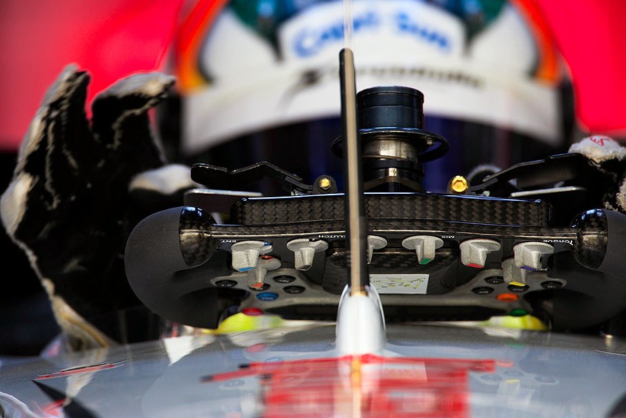 Adrian Sutil grabs the steering wheel