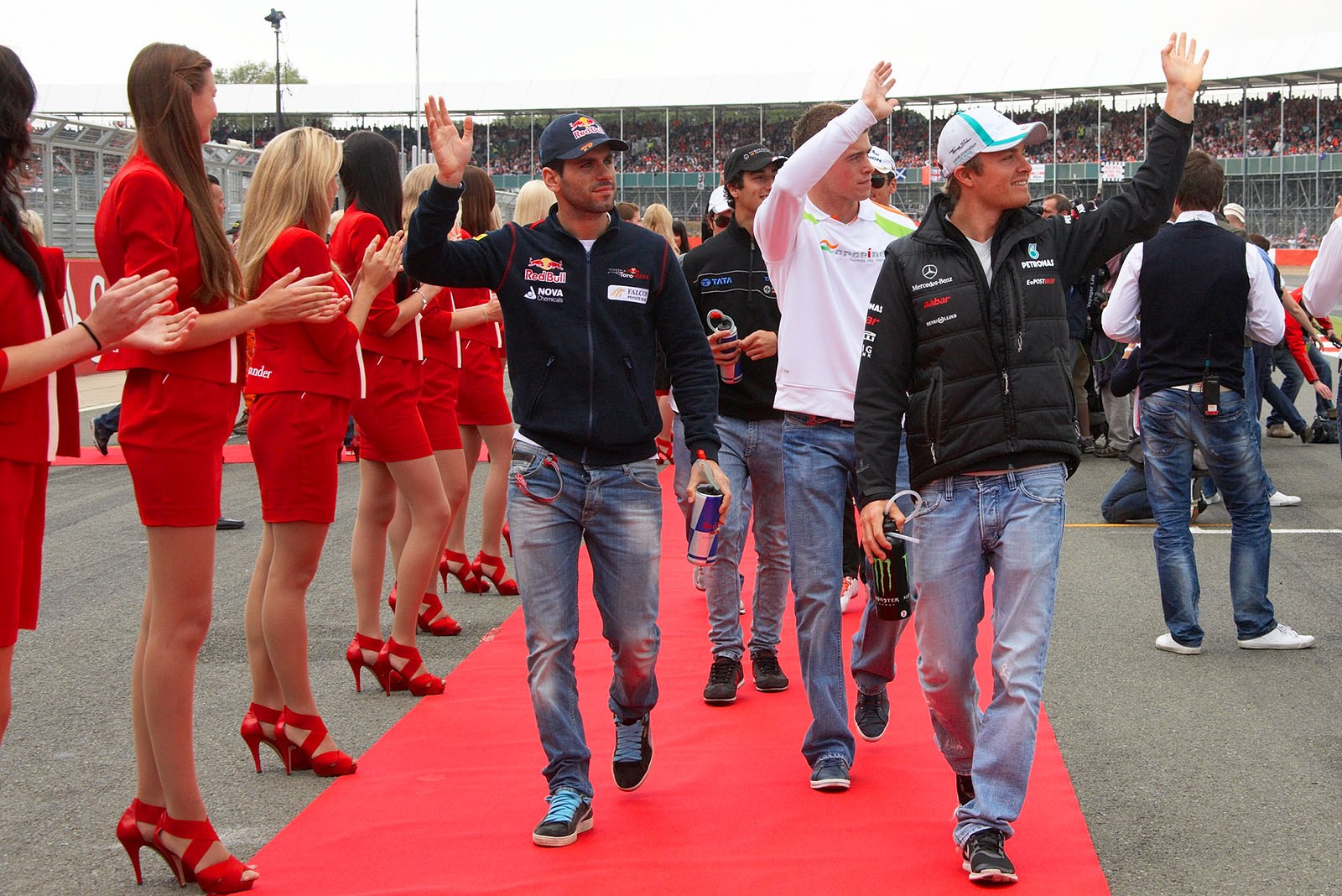 Jaime Alguersuari and Nico Rosberg walk waving to drivers parade