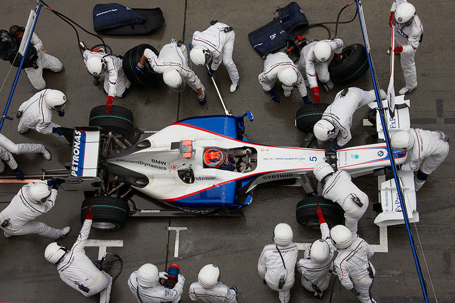 Kubica at BMW Sauber pits, receiving a new nose cone after a collision with Trulli in lap 18