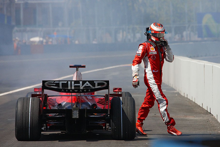 Kimi Raikkonen leaves the retired Ferrari