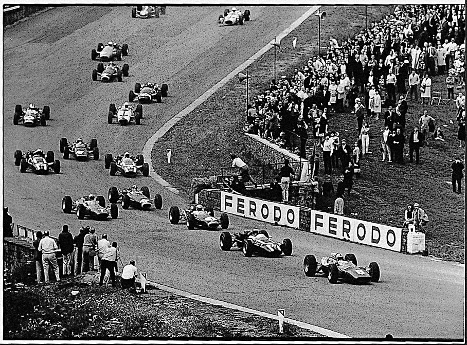 Leading the Belgium GP 1966 start field, Surtees enters Eau Rouge in front of Rindt