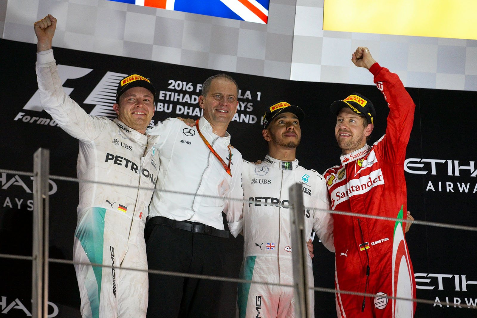 Final podium shot with Nico Rosberg as the new World Champion 2016, Nico's race engineer Tony Ross, race winner but dethroned champion Lewis Hamilton, and Sebastian Vettel, Abu Dhabi Grand Prix, 2016