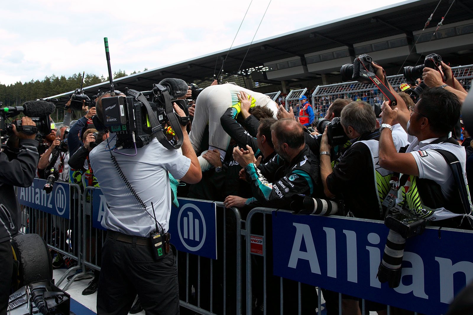 Winner Nico Rosberg crowd-surfing with his Mercedes mechanics, Spielberg, Austrian Grand Prix, 2015