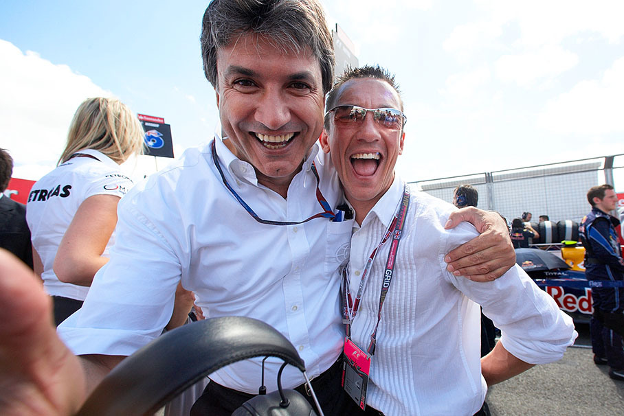 FOM's Pasquale Lattuneddu poses with Italian jockey Frankie Dettori for a souvenir photo on the grid