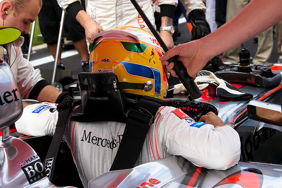 Lewis Hamilton exits the cockpit