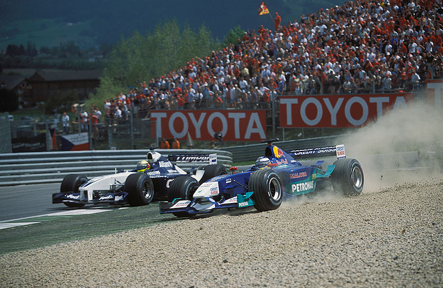 Nick Heidfeld in the dirt besides Ralf Schumacher