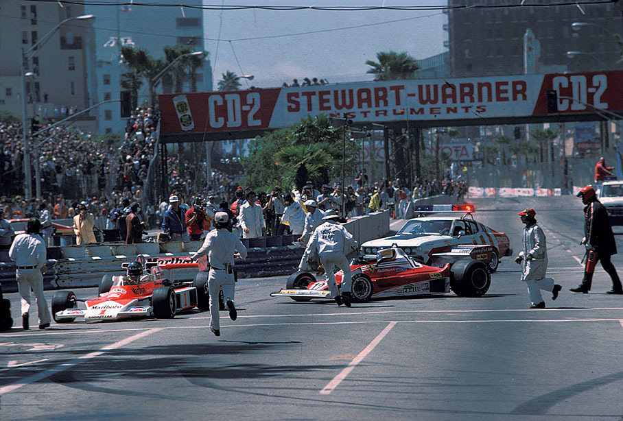 At the start of the United States GP at Long Beach 1977, Carlos Reutemann in the Ferrari, brakes to late into the 1st corner and steers around Hunt's McLaren