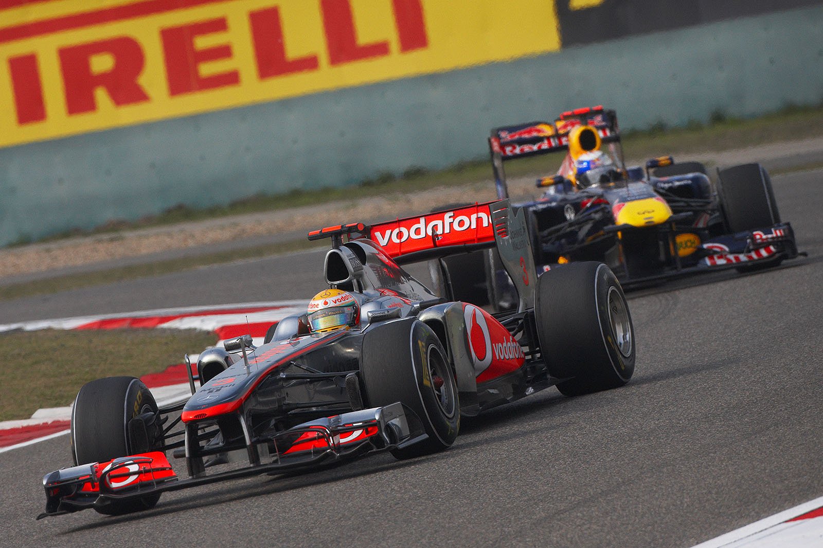 McLaren's Lewis Hamilton in front of Vettel