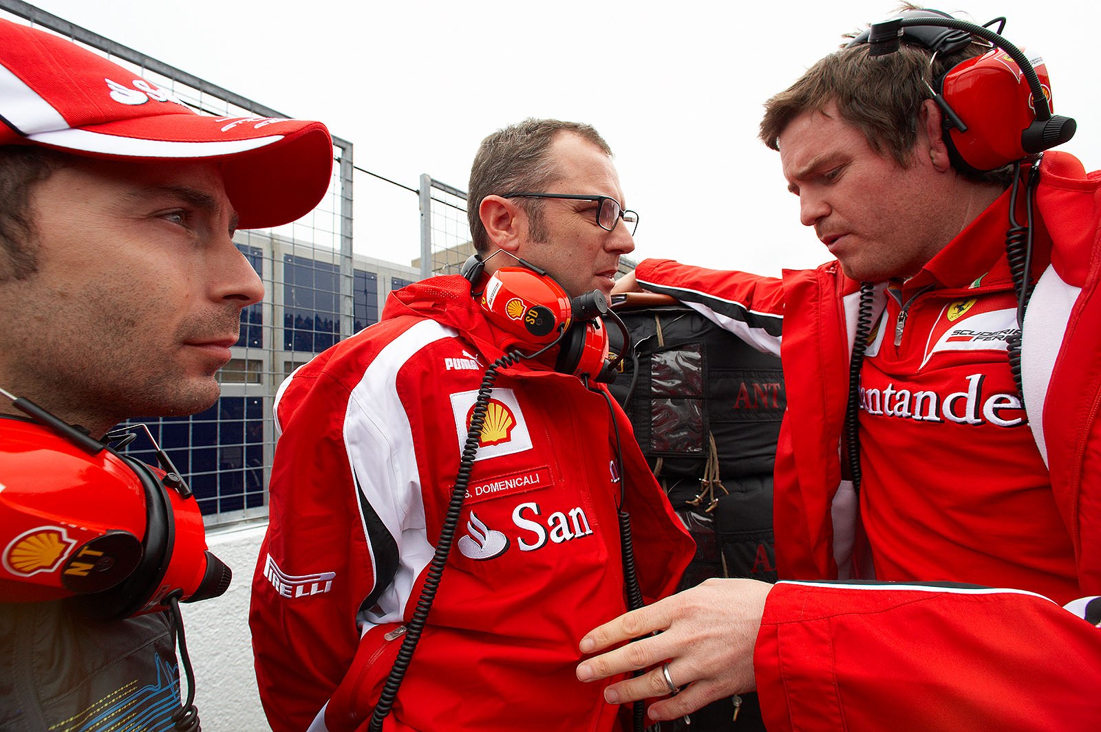 Ferrari team boss Stefano Domenicali talks on the grid with Massa's manager Nicolas Todt and race engineer Rob Smedley