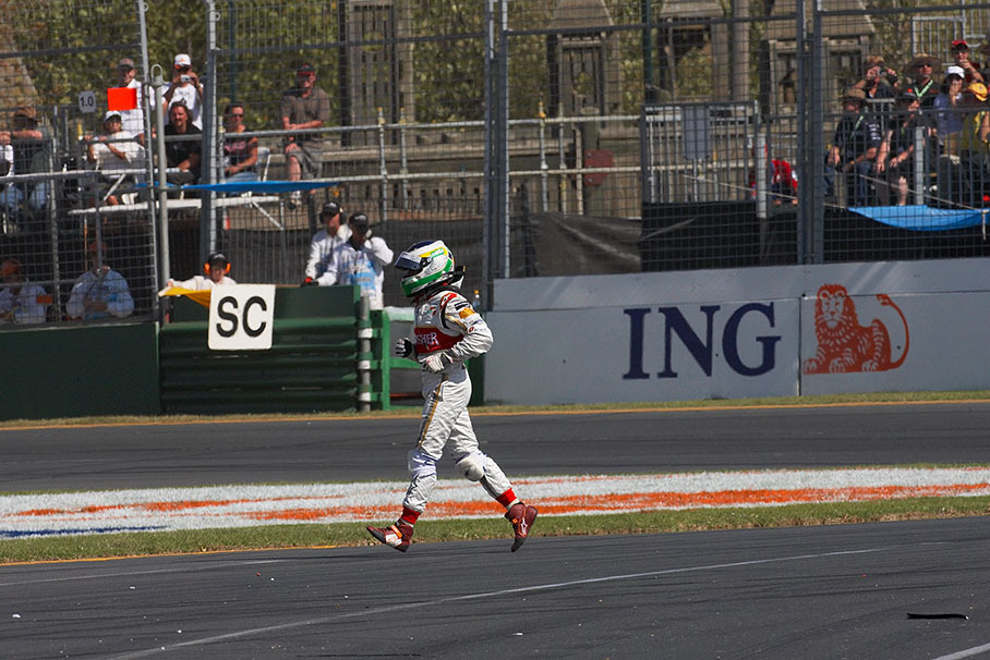 Giancarlo Fisichella crosses the track during a safety car period after start crash