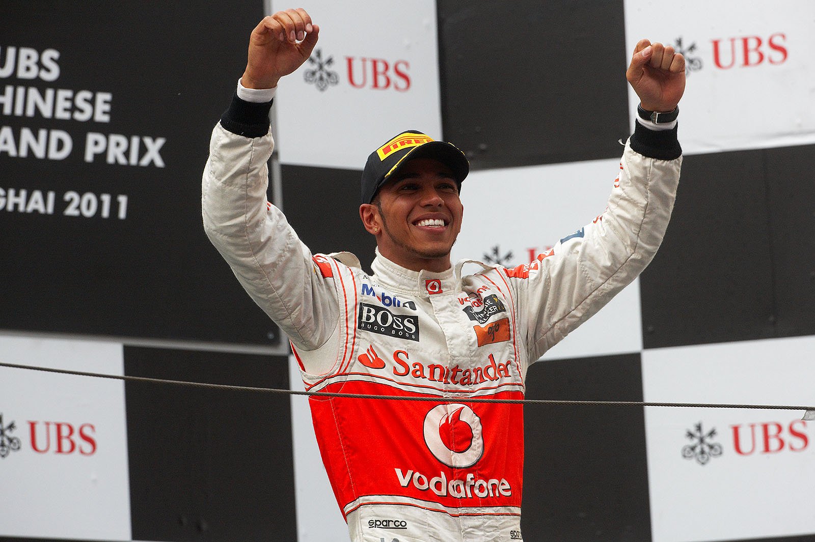 Race winner Lewis Hamilton, McLaren, celebrates on the podium after the Chinese GP