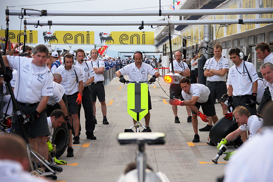 Mercedes mechanics practise pit stops in front of the fans during the public pit lane walkabout on Thursday afternoon