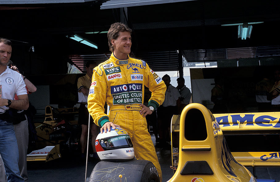 Michael Schumacher poses behind his Benetton-Cosworth