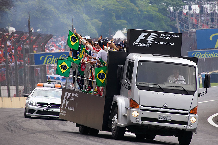 During drivers parade some of the drivers greet the fans with the Brazilian national banner