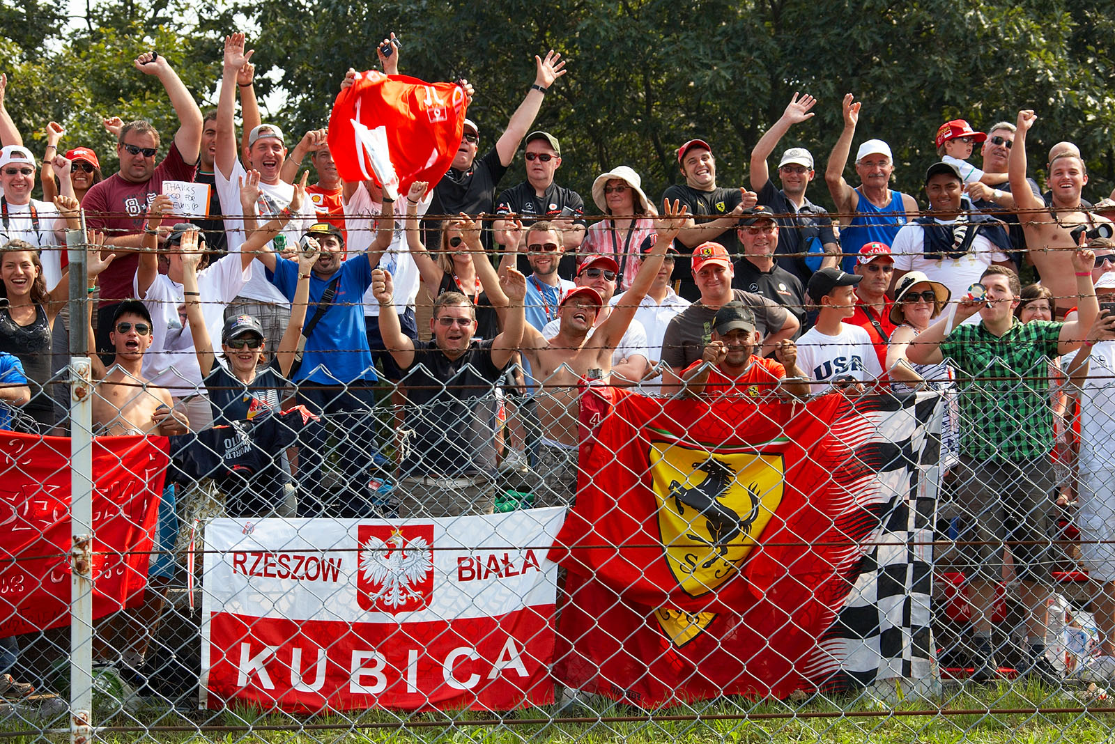 Fans behind the fence