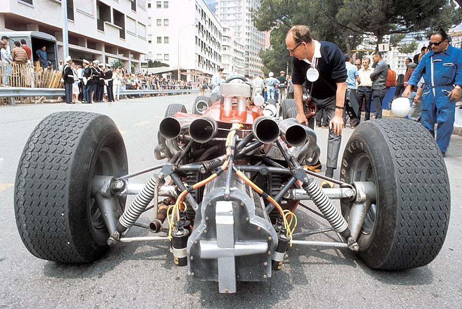 German enterpriser Wendelin Schell takes a close look at a fake F1 car which was made  especially for John Frankenheimer's awarded motion picture GRAND PRIX from 1967 -  note the wooden dummy gearbox.