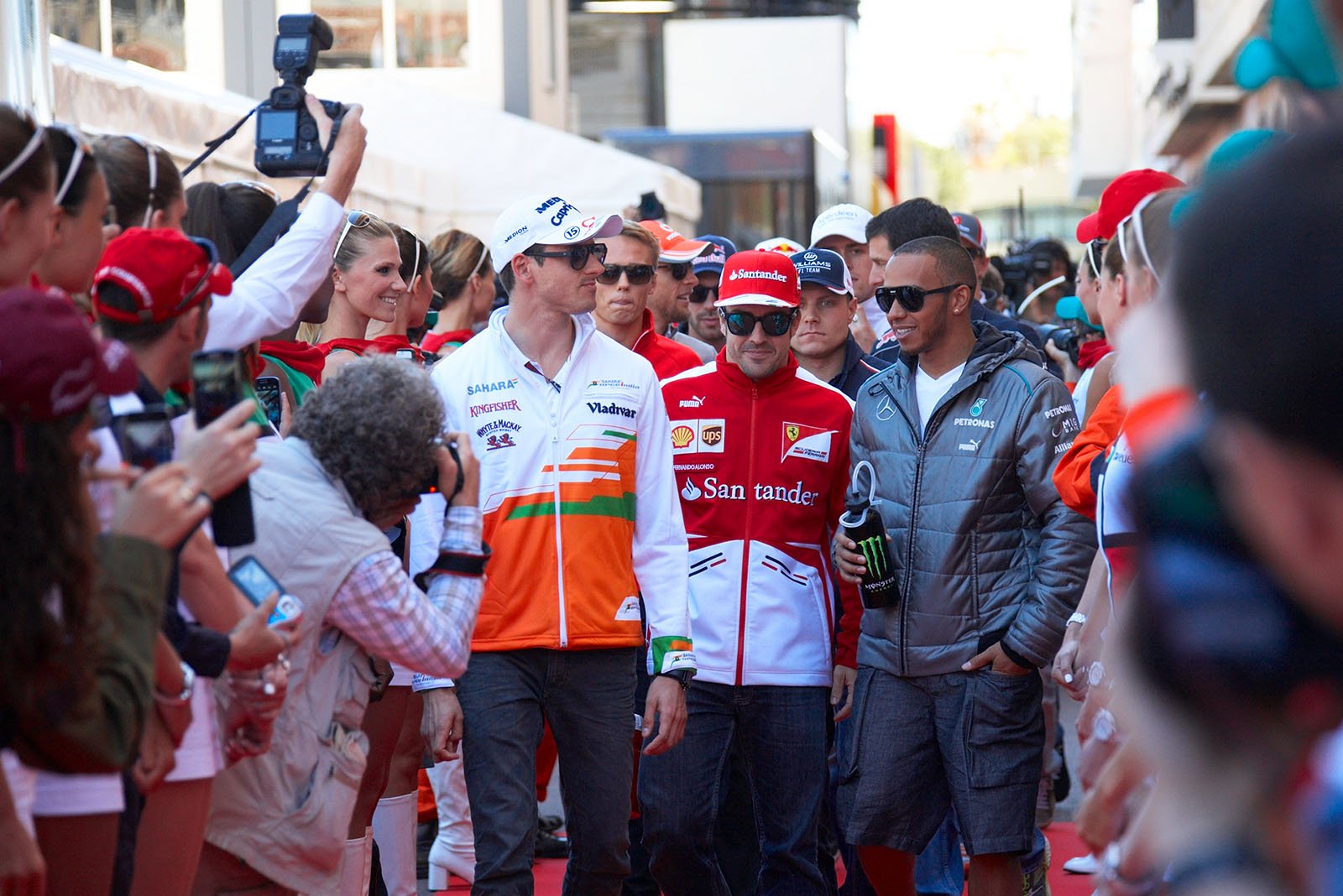 Sutil, Alonso and Hamilton walk to drivers parade