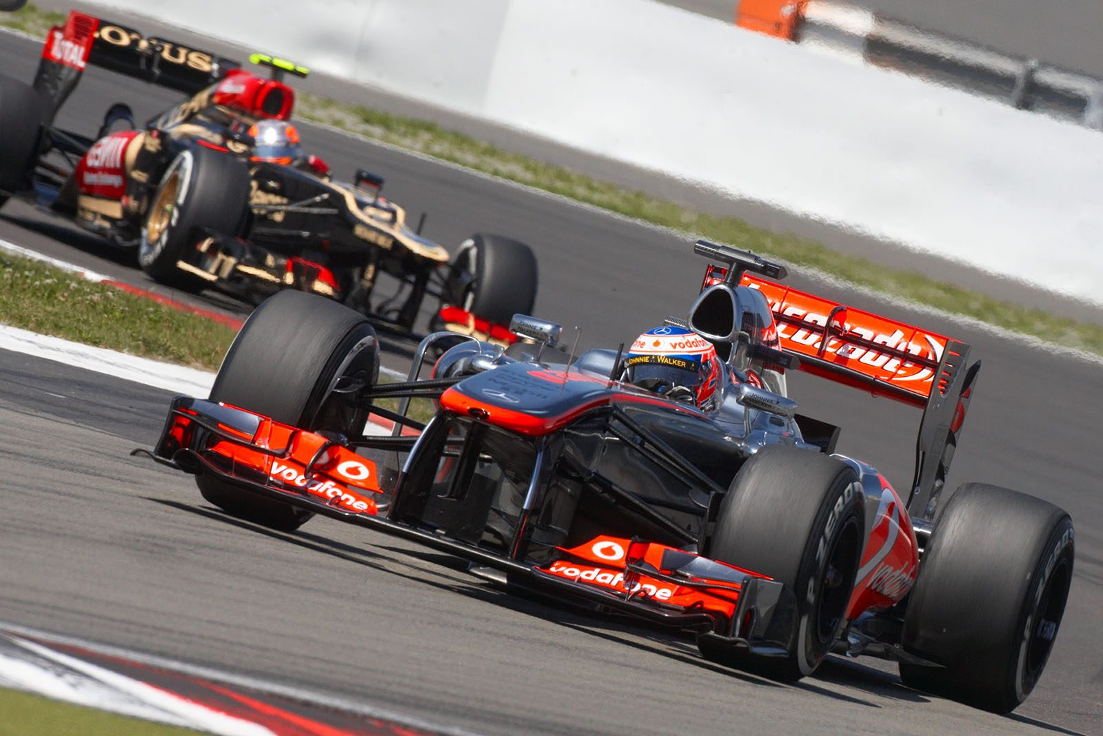 Jenson Button, McLaren Mercedes, in front of Grosjean