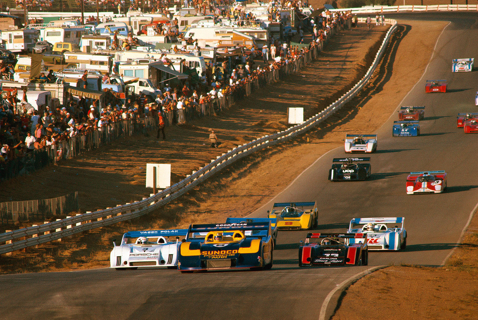 Mark Donohue (USA) in the no. 6 Sunoco Porsche 917, leads the field, followed by Redman's Porsche 917 no. 3 and Hobbs' McLaren-Chevrolet no. 73.