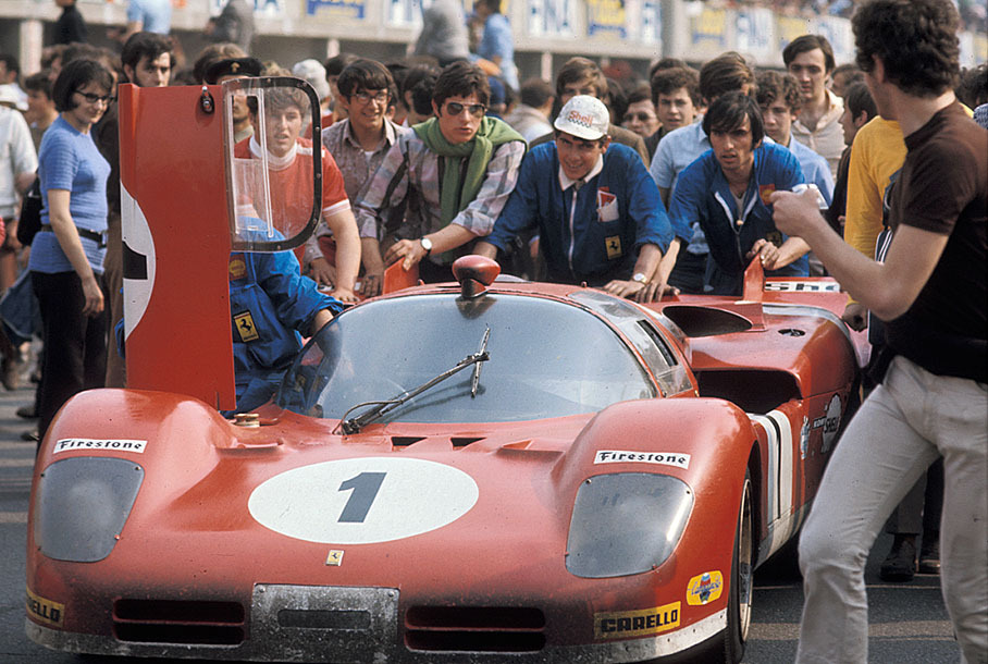 Fourth placed Ferrari 512 S 1026 of Chris Amon (NZ) and Arturo Merzario (I) is being pushed through pitlane to parc ferme