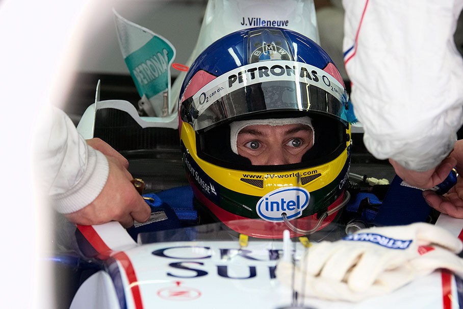 Jacques Villeneuve being fit into his cell with seatbelts