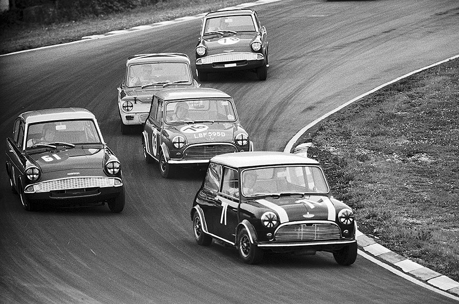 John Handley on BMC Mini Cooper in front of Fitzpatrick's Ford Anglia and Steve Neal's Mini of Equipe Arden
