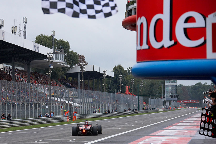 Sebastian Vettel takes the chequered flag and breaks the record as youngest Grand Prix winner ever