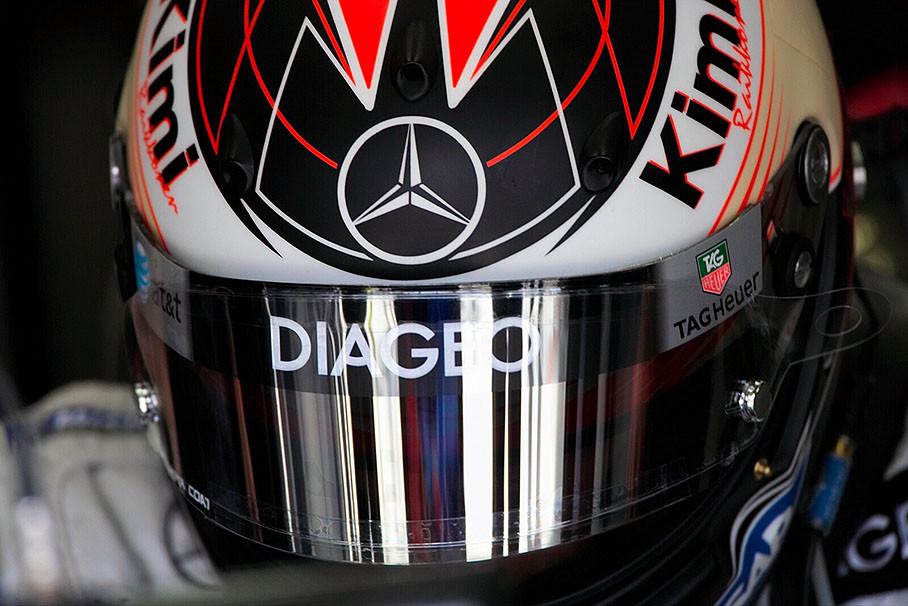 McLaren-Mercedes driver Kimi Raikkonen with his helmet visor nearly flapped down as usual while in the pits