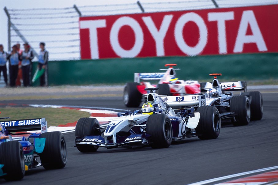 Ralf Schumacher passes first corner between other contestants