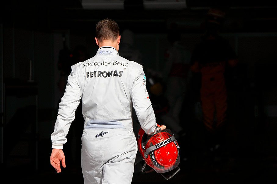 Mercedes star Michael Schumacher walks to FIA scales after qualifying for seventh grid position