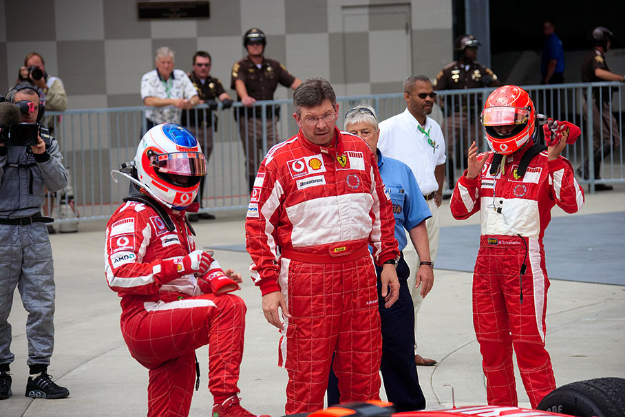 After a memorable 2005 US GP with only six Bridgestone-equipped cars crossing the finish line, Ferrari's Barrichello, Brawn and Schumacher stand in parc ferme