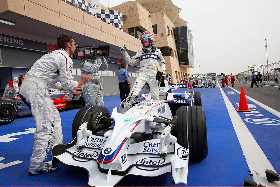 Polesetter Robert Kubica arrives at Bahrain's parc ferme