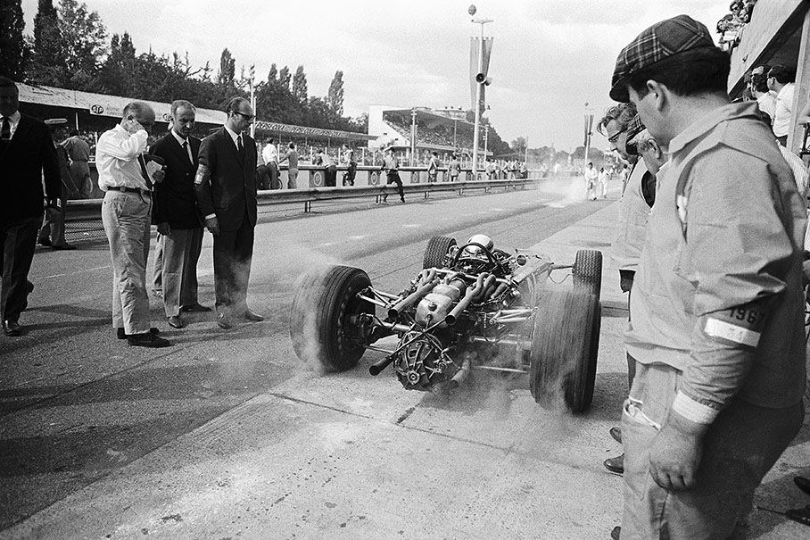 Jackie Stewart, BRM P83, driving out of the pits with spinning wheels