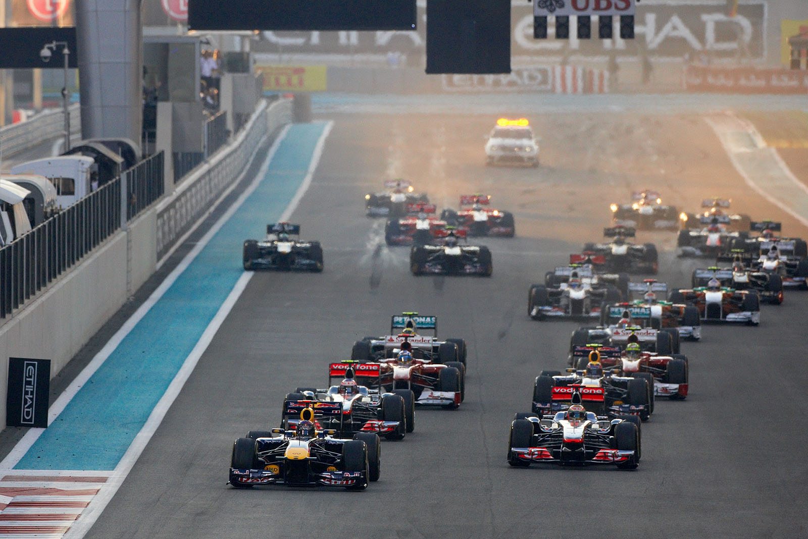 The cars accelerate after the start signal, Vettel leads the field in front of the two McLaren-Mercedes cars of Hamilton and Button