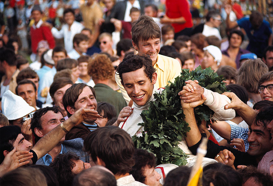Winner Jacky Ickx on his way from podium, Austrian GP 1970