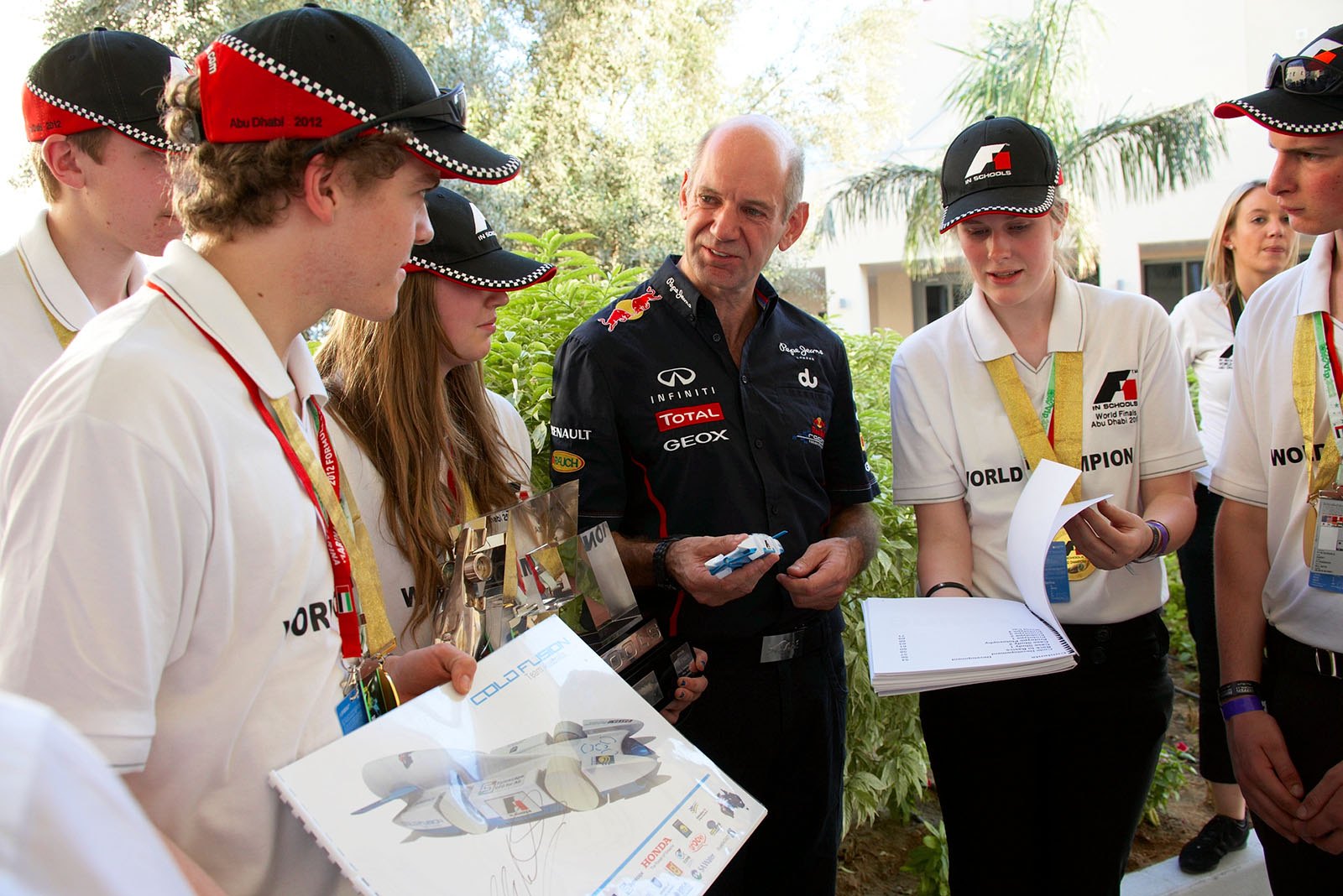 Meanwhile a star on his own, Red Bull's chief technical officer Adrian Newey gives autographs to the F1 in School Champions in the paddock