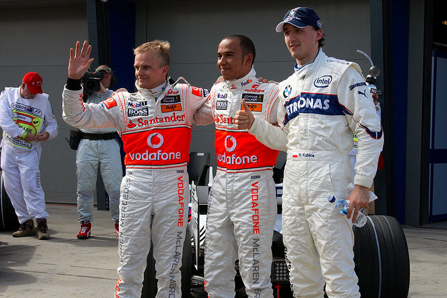 The fastest three qualifiers pose for the media after Q3 in parc fermé: Third grid placed Heikki Kovalainen and polesitter Lewis Hamilton of McLaren Mercedes with grid's second positioned Robert Kubica of BMW Sauber.