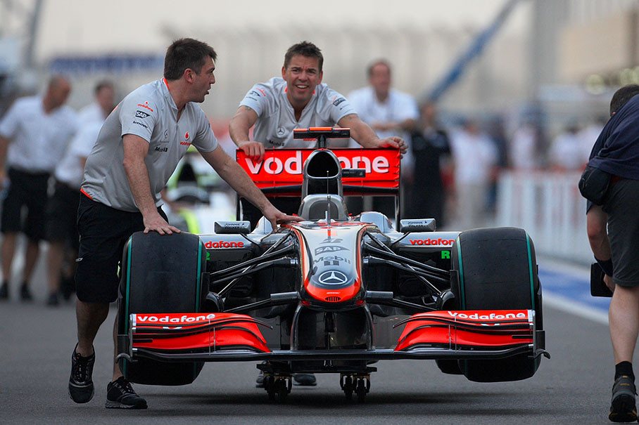 The McLaren Mercedes car is being pushed to scrutineering pits