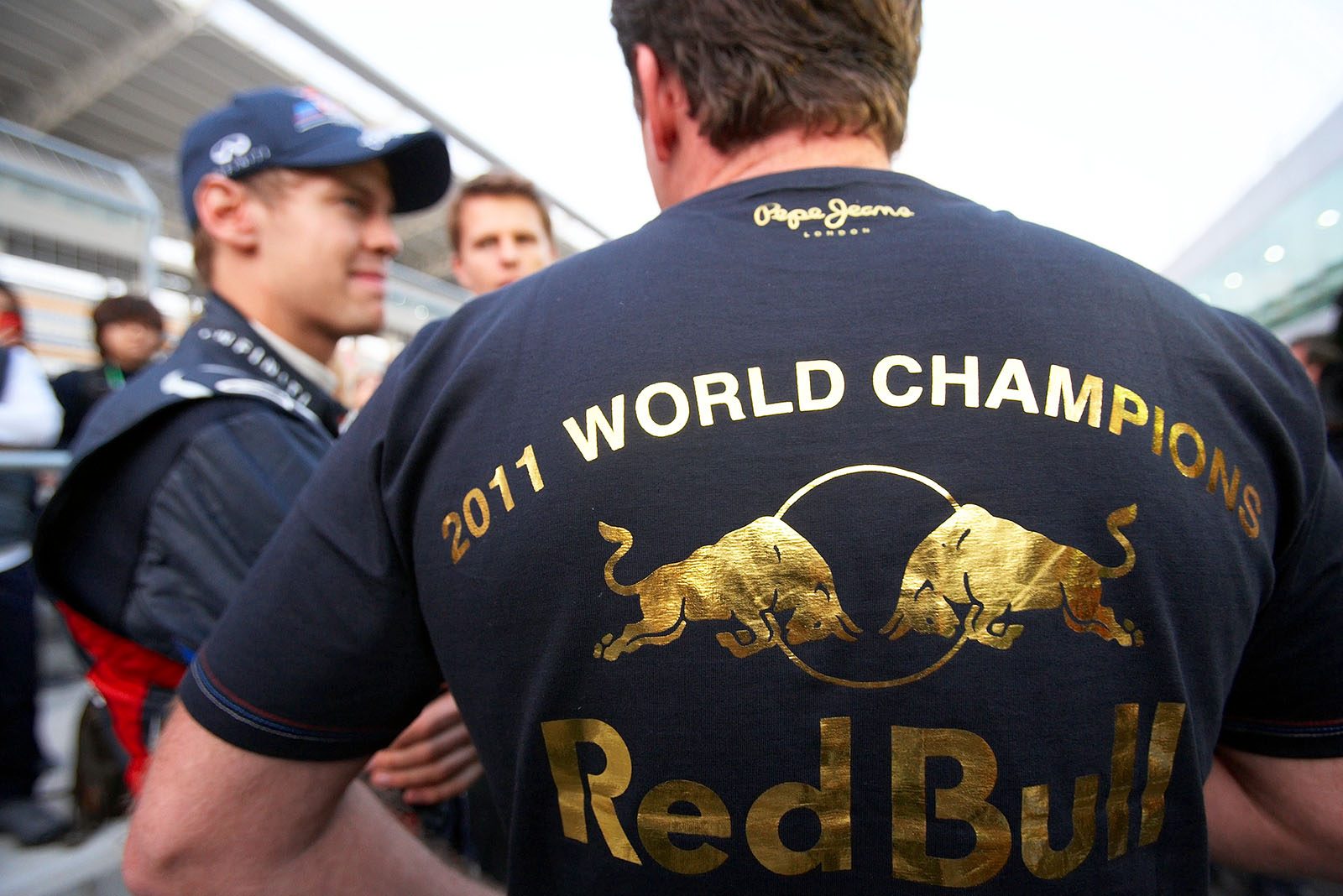 Red Bull Racing team boss Christian Horner celebrates their win of the F1 constructor championship after the Korean GP with a new golden T-shirt edition