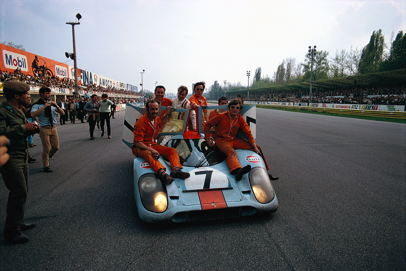 The winning Porsche 917K 016 of Pedro Rodriguez (MEX) and Leo Kinnunen (SF) finishes the honoury lap with many mechanics as passengers